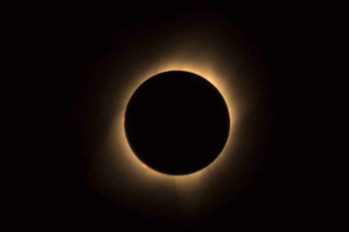 Eclipse over pyramids